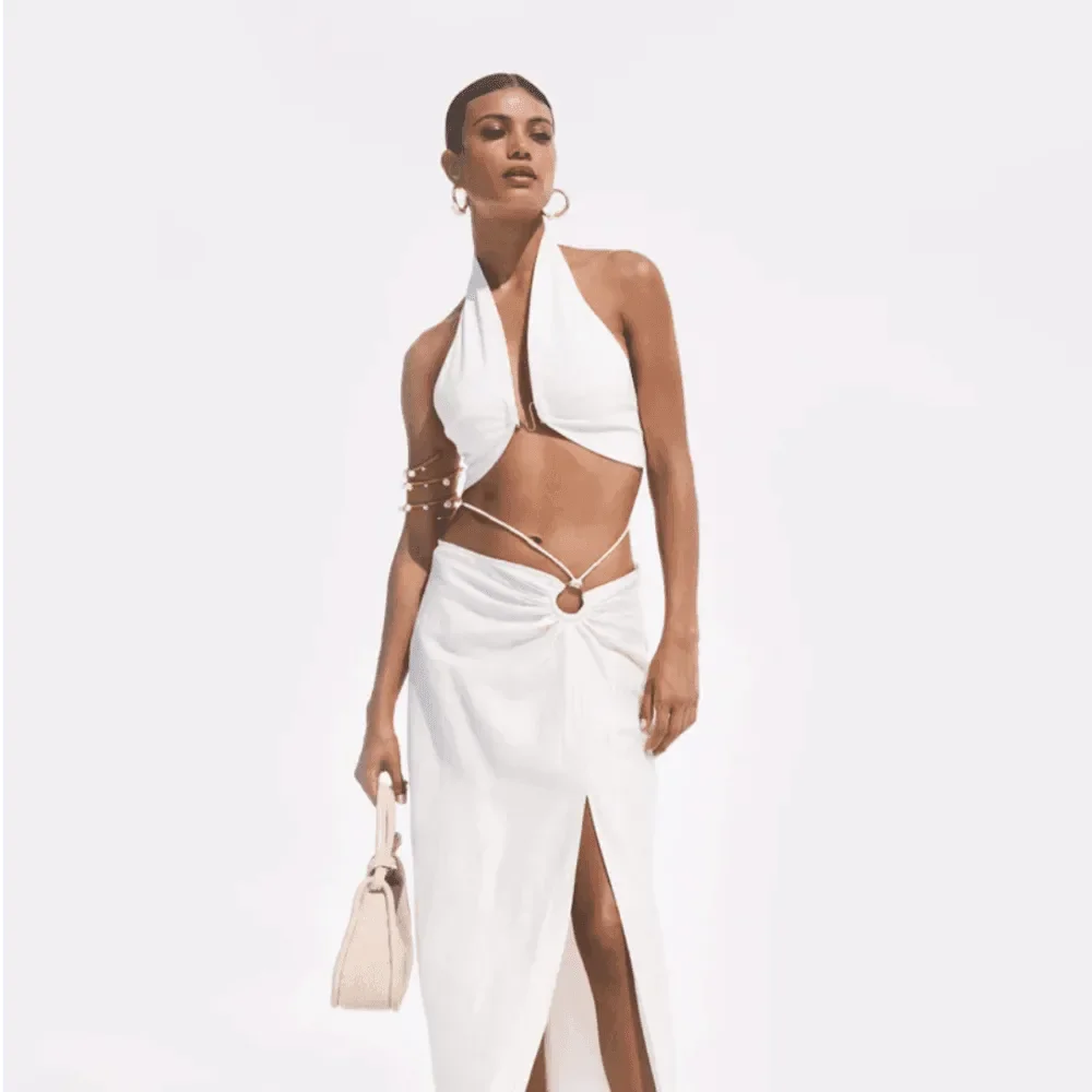 white cut-out halter top and slit skirt co-ord, evening look