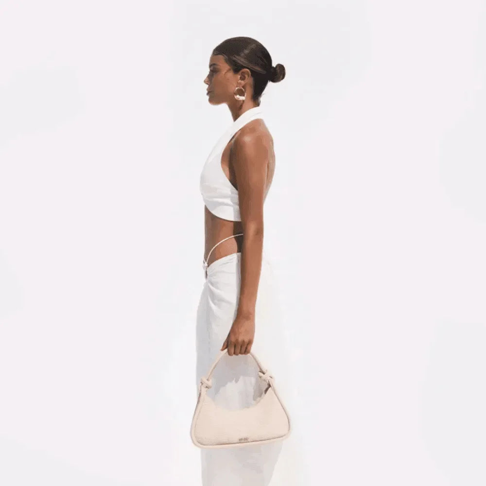 white halter top with cut-out sides and matching maxi skirt, evening look
