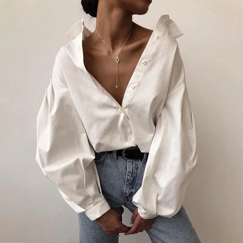 puff-sleeve button-up blouse with deep neckline, casual style