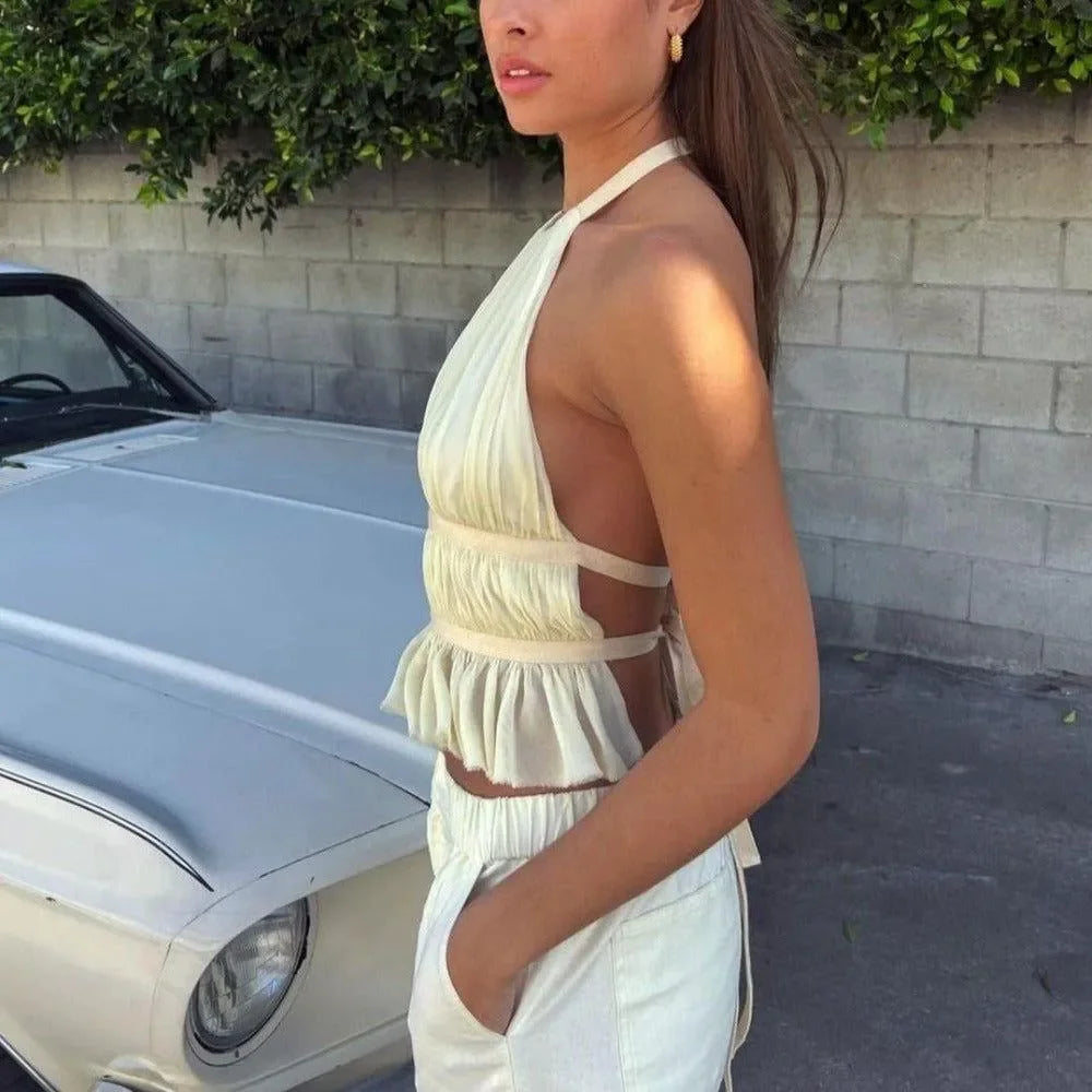 ruffled halter top with cutout sides and matching high-waisted pants, casual chic style