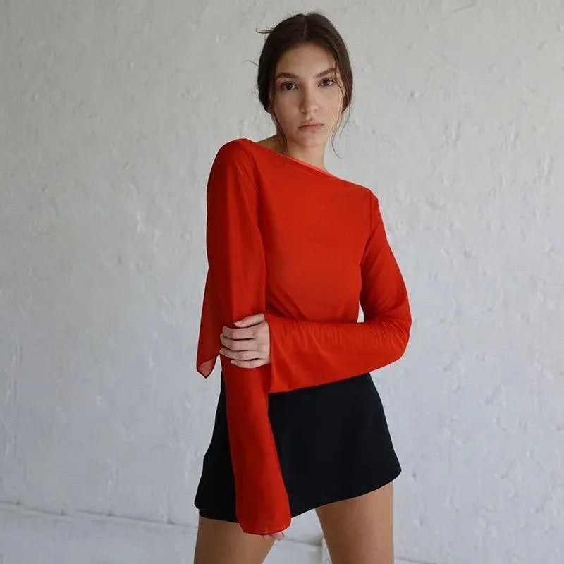 long-sleeve red top with black mini skirt, casual chic style