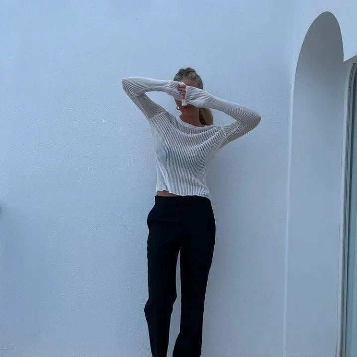 ribbed long-sleeve top with black trousers, casual style