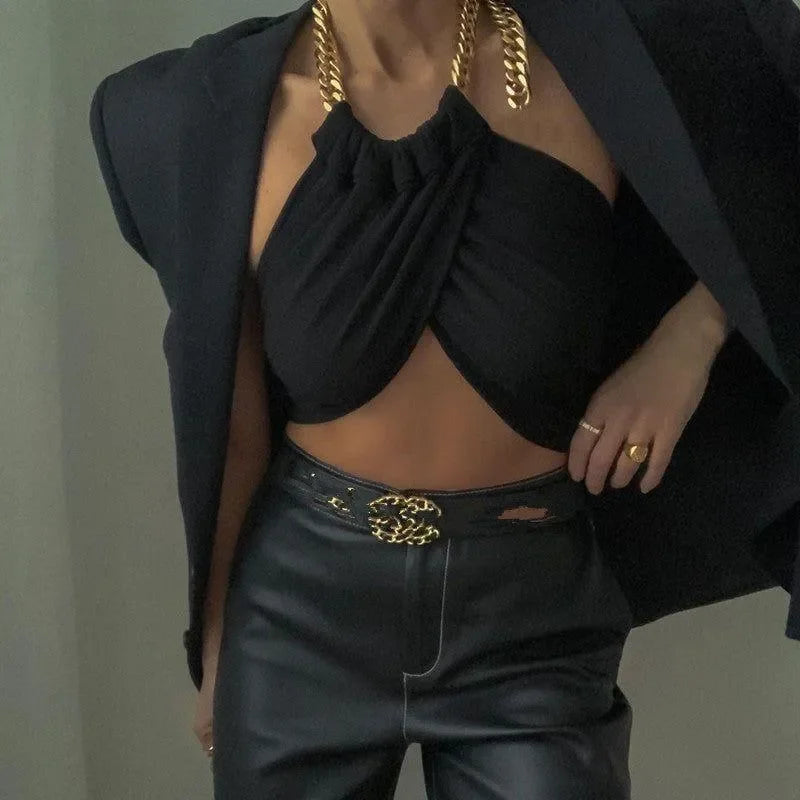 chain halter top with blazer and leather pants, chic evening style