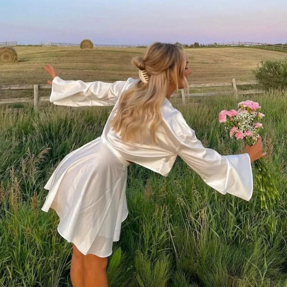 white satin mini dress with flared sleeves
