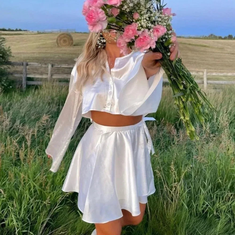 white satin long-sleeve crop top and skirt co-ord, day look