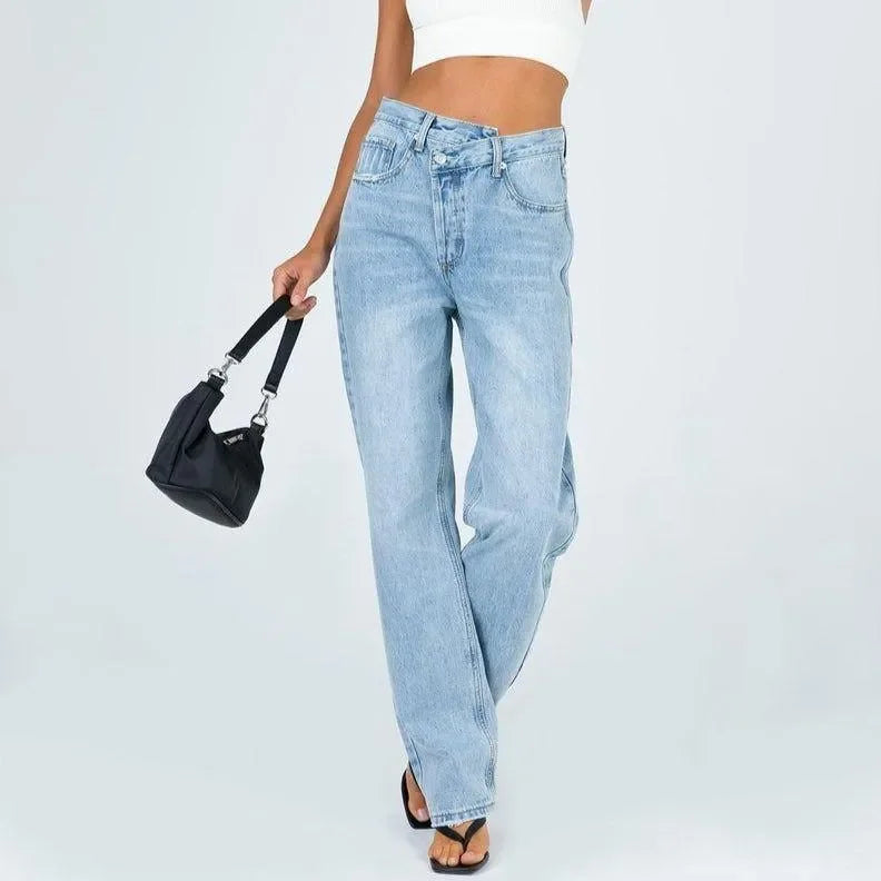 high-waisted jeans with straight leg and black shoulder bag