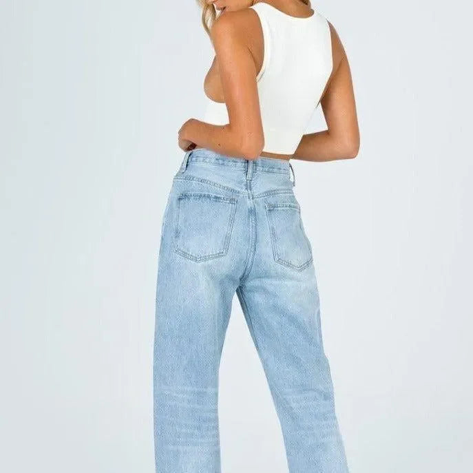 ribbed white crop top paired with high-waisted light wash jeans