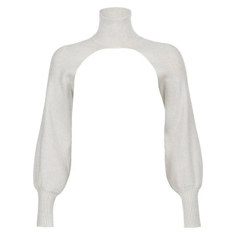 Cream turtleneck crop sweater with open back and balloon sleeves, perfect for layering or pairing with high-waisted bottoms.