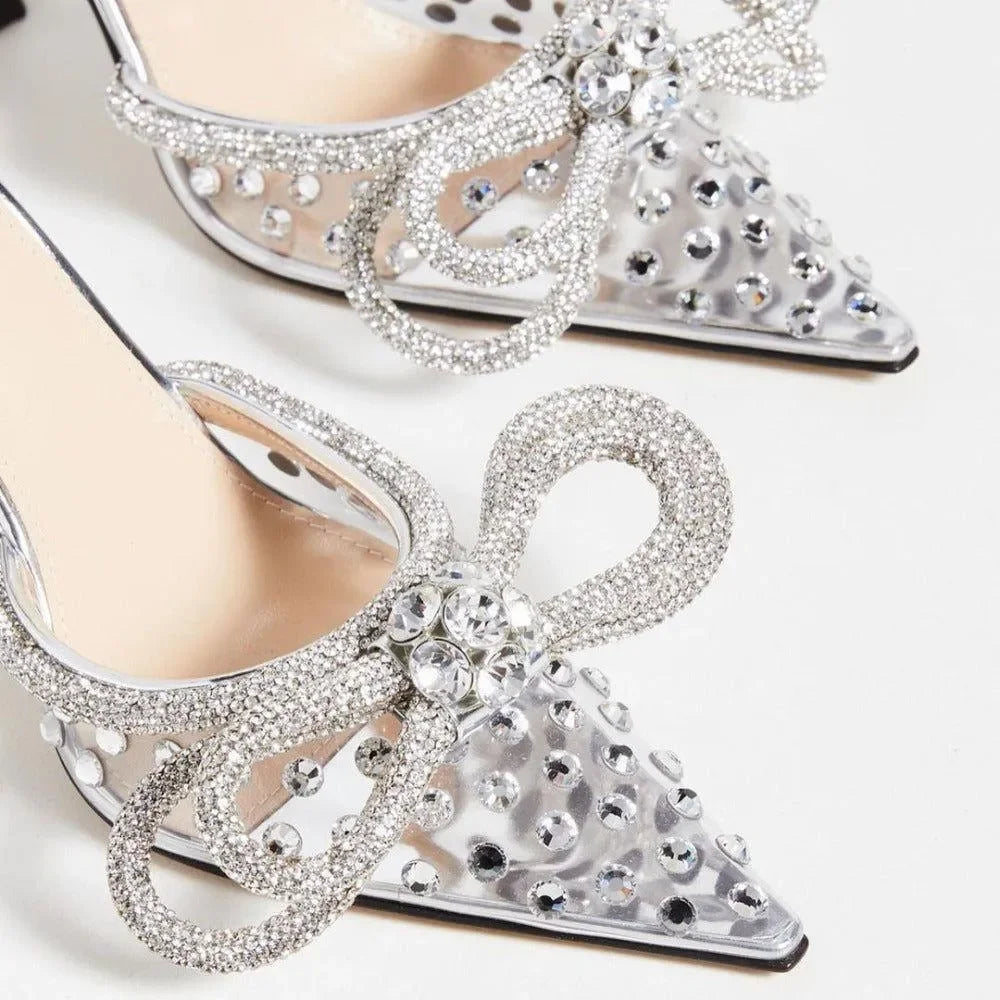 crystal-embellished pointed-toe heels with bow detailing