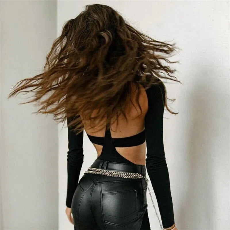 backless crop top with long sleeves and leather pants, night-out style