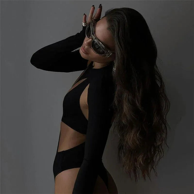 cut-out black long-sleeve top and high-waisted bottoms, night-out style