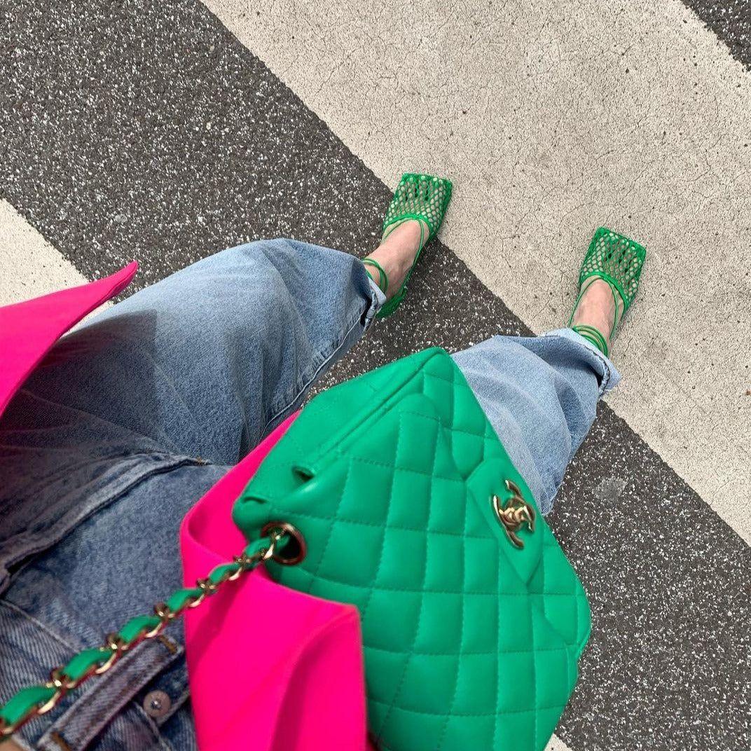Person wearing green mesh shoes