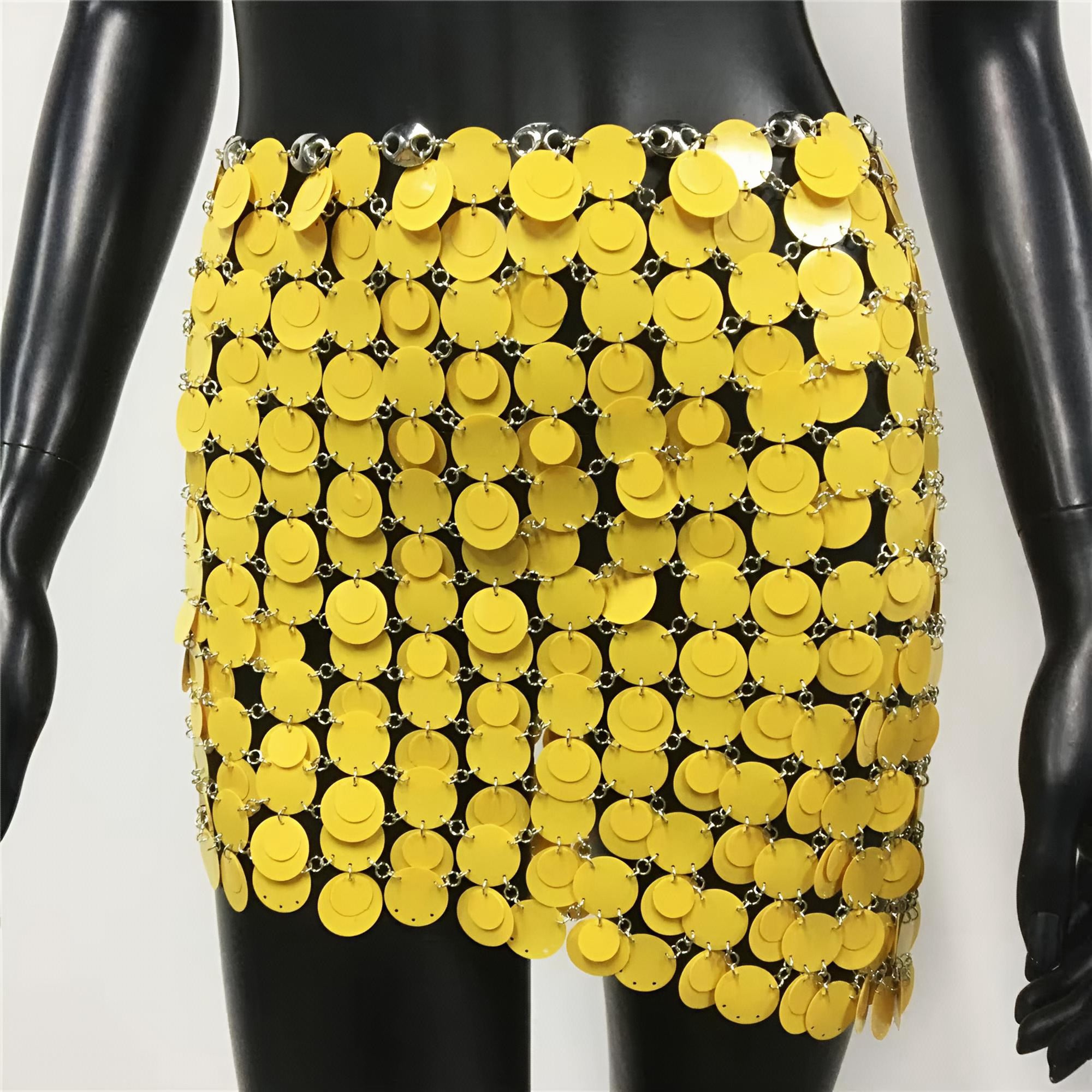 Mannequin wearing a bright yellow sequin skirt on a white background