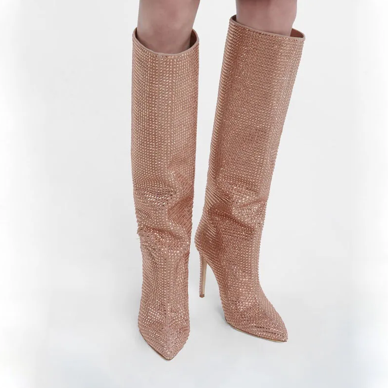 Rose gold knee-high boots on a white background