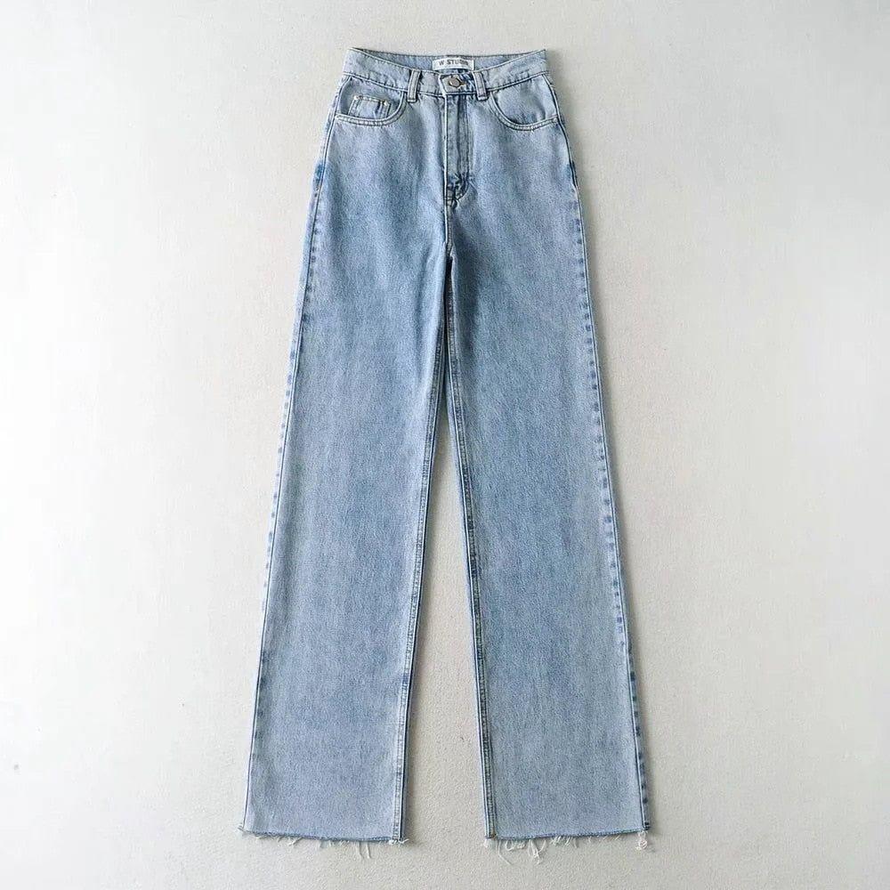 Light blue jeans on a gray background