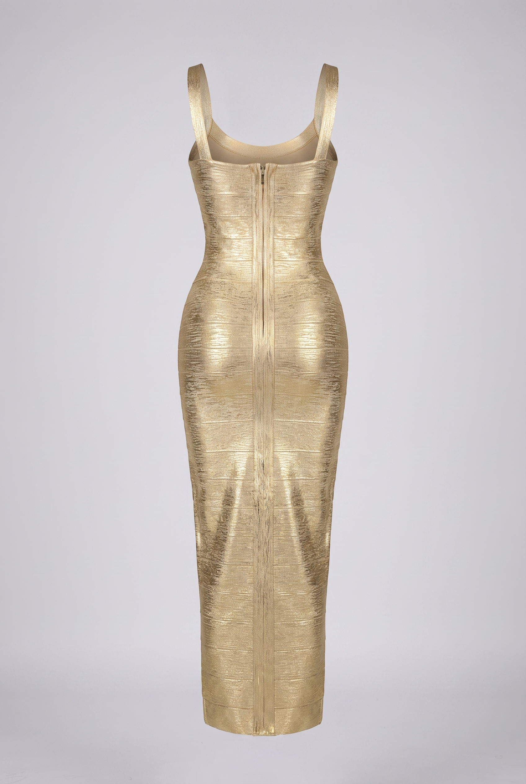 Gold metallic bandage maxi dress, full body front view on stairs