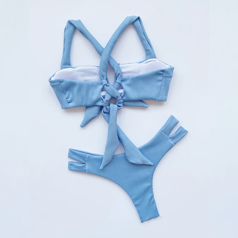 Blue ribbed bikini set on a light gray background