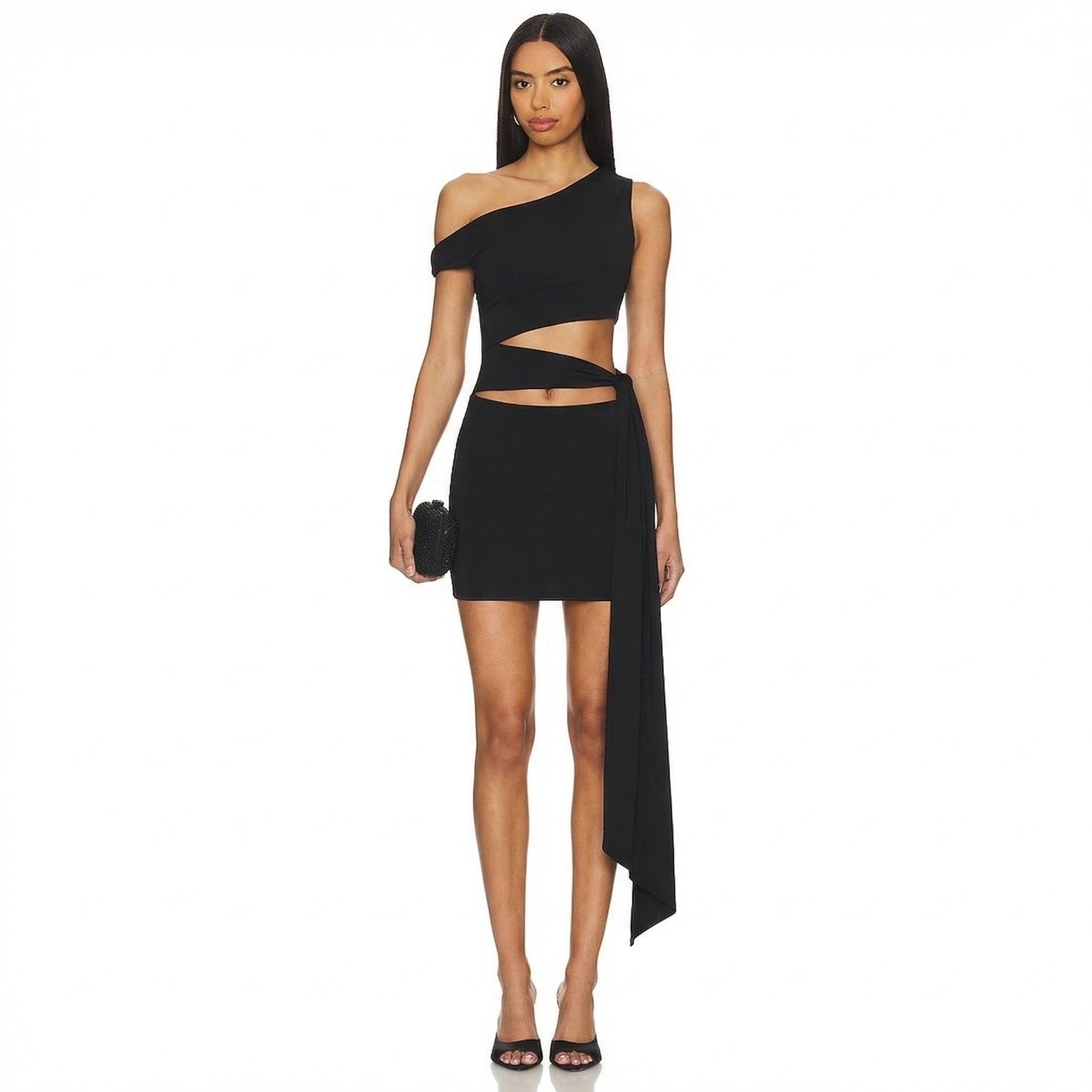 Woman wearing a black one-shoulder dress with cut-out design on a white background