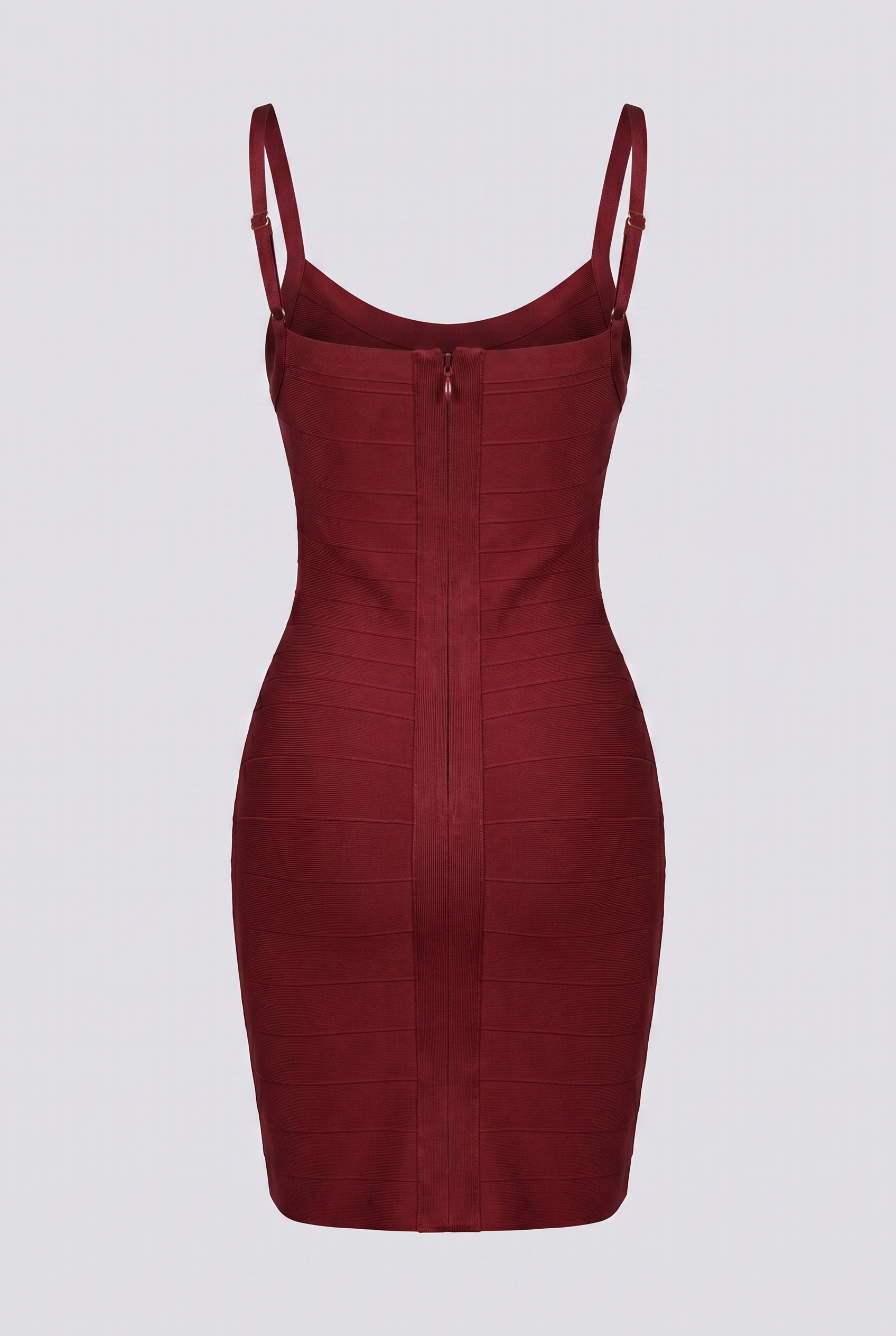Model in burgundy bandage mini dress, vintage-themed editorial shot