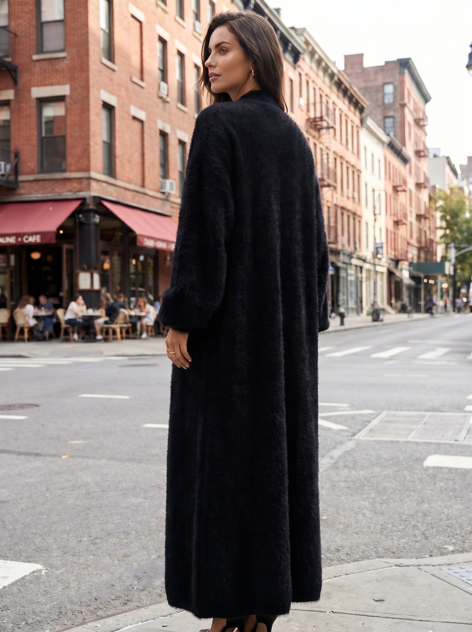 a long black cardigan with a high slit