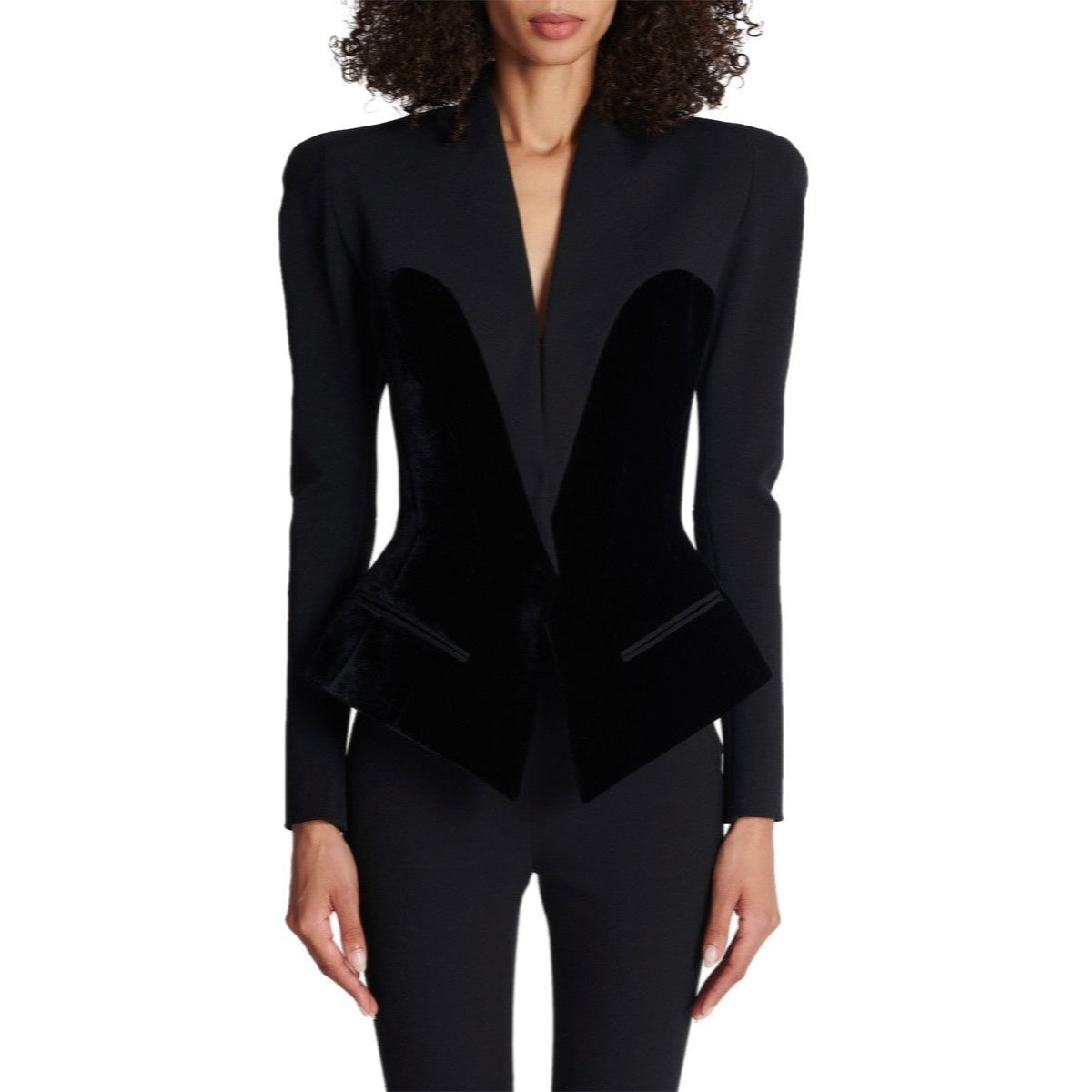 Black blazer worn by a model on a white background
