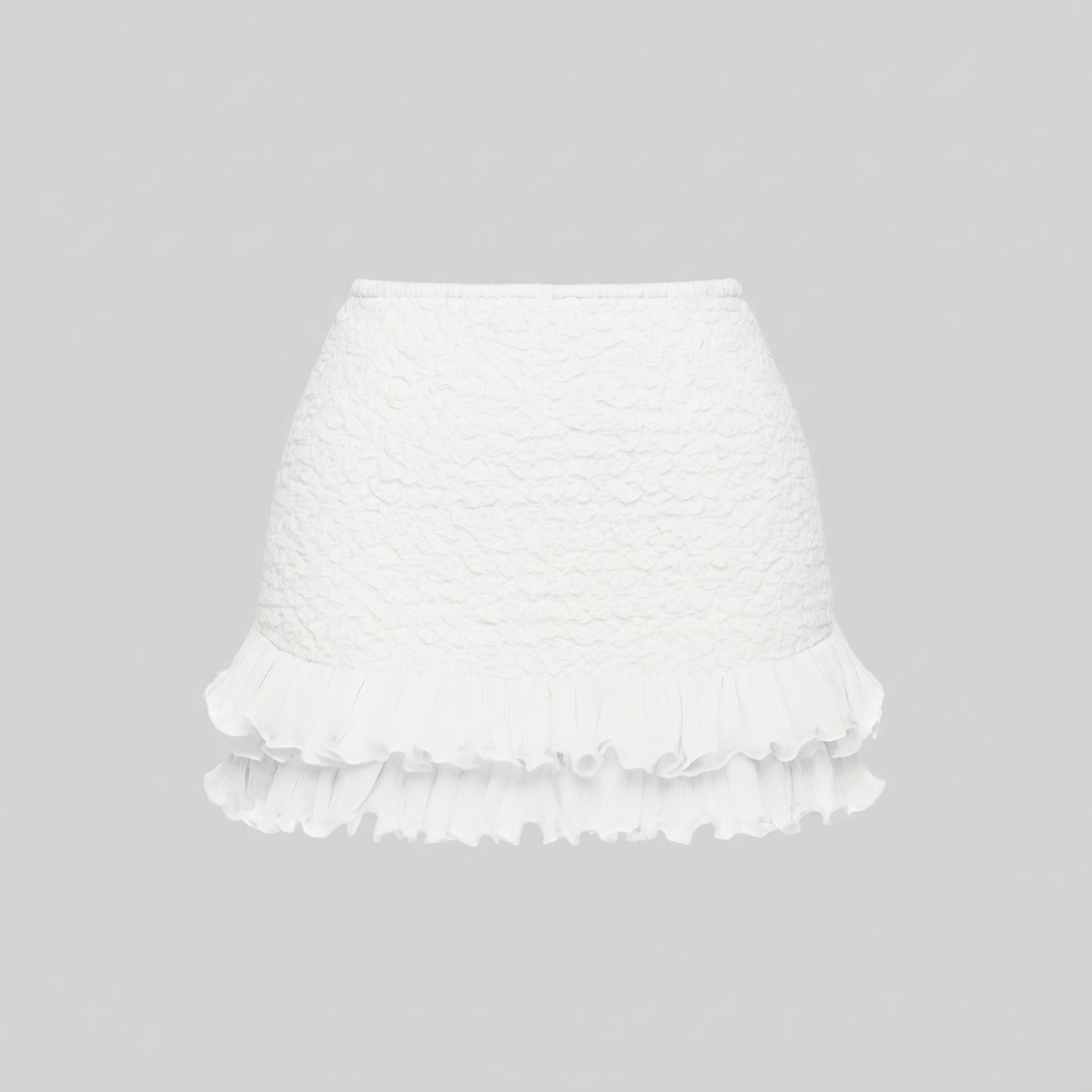 White ruffled skirt on a gray background