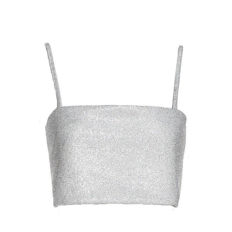 Silver glittery crop top with thin straps on a white background