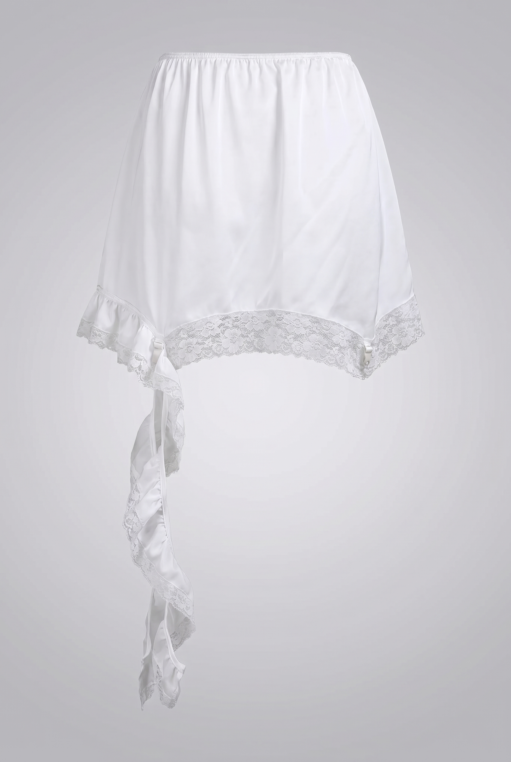 White satin mini skirt with feminine ruffle and lace detail, full-length shot