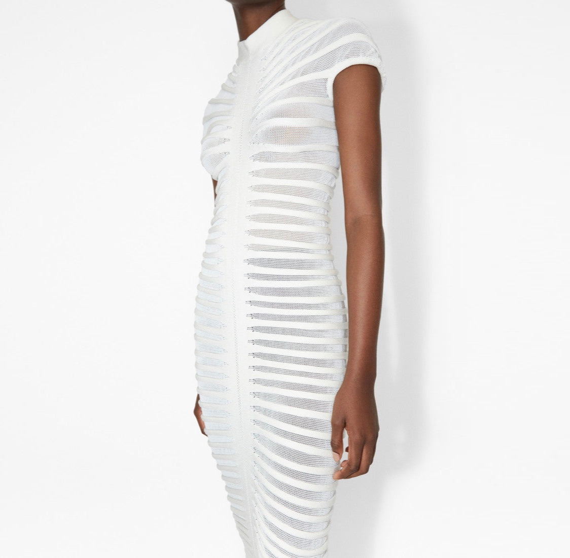 White dress with a textured pattern on a white background