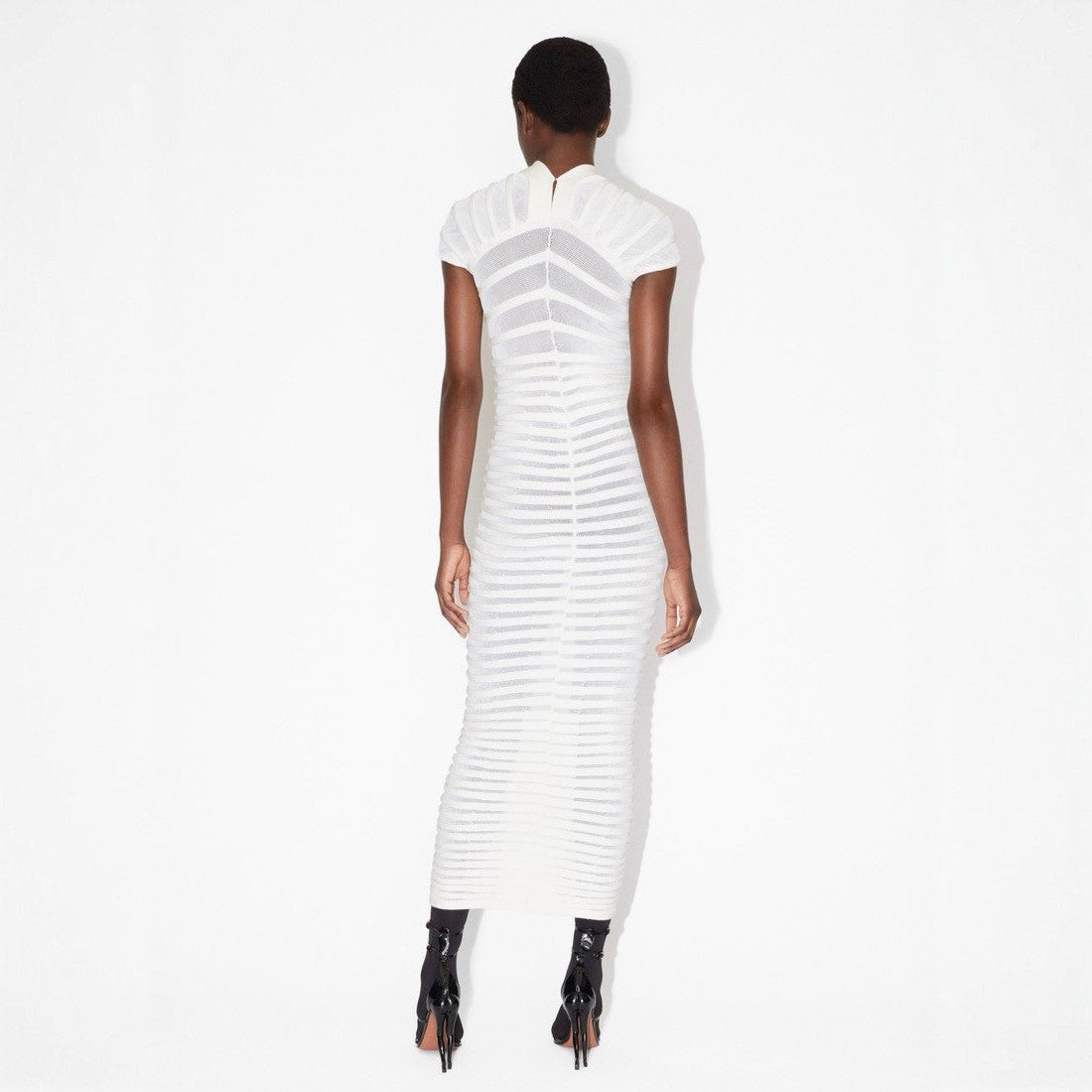 White dress with a geometric pattern on a white background