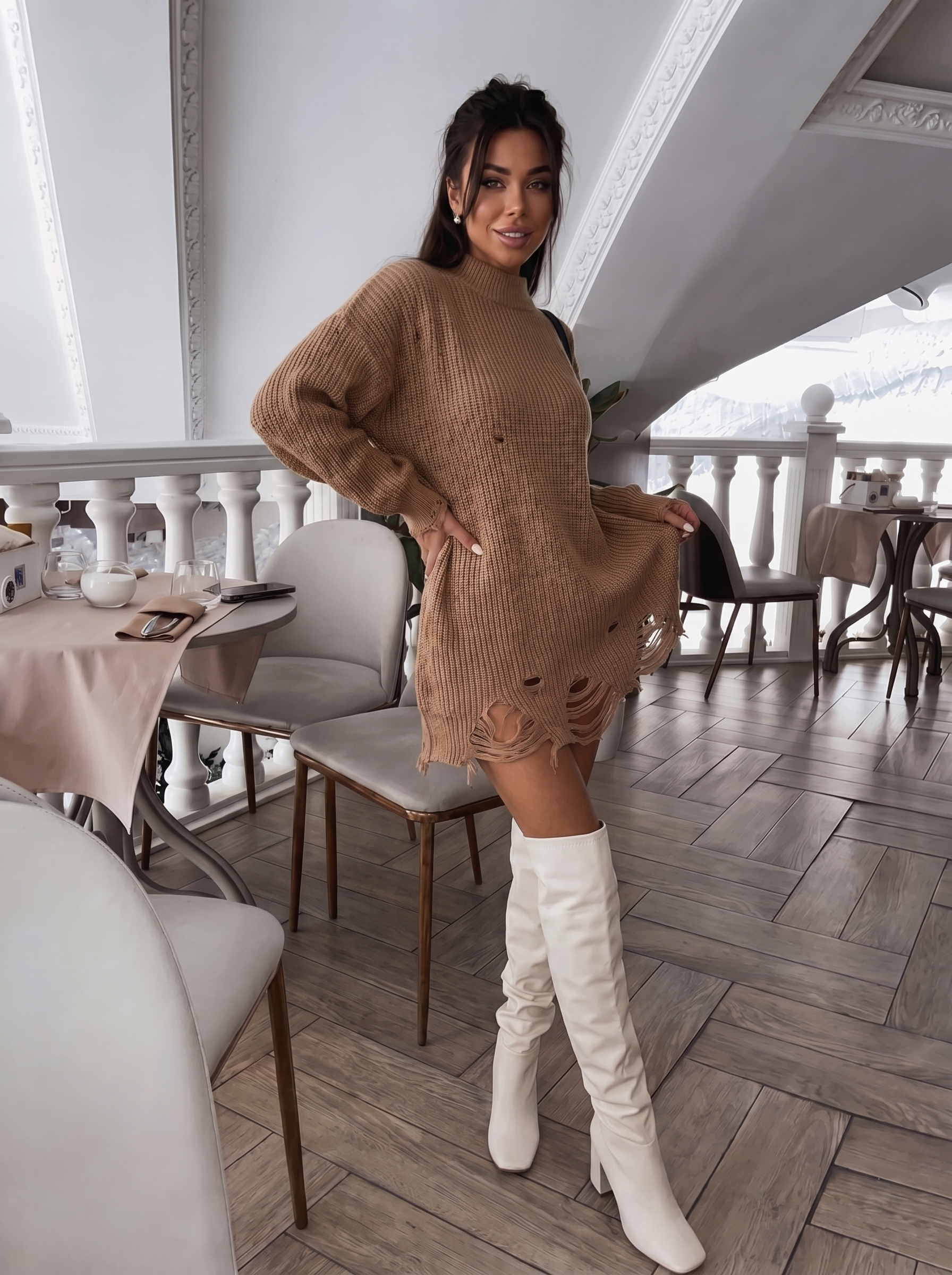 Ribbed knit sweater dress paired with knee-high slouchy boots, chic casual outfit.