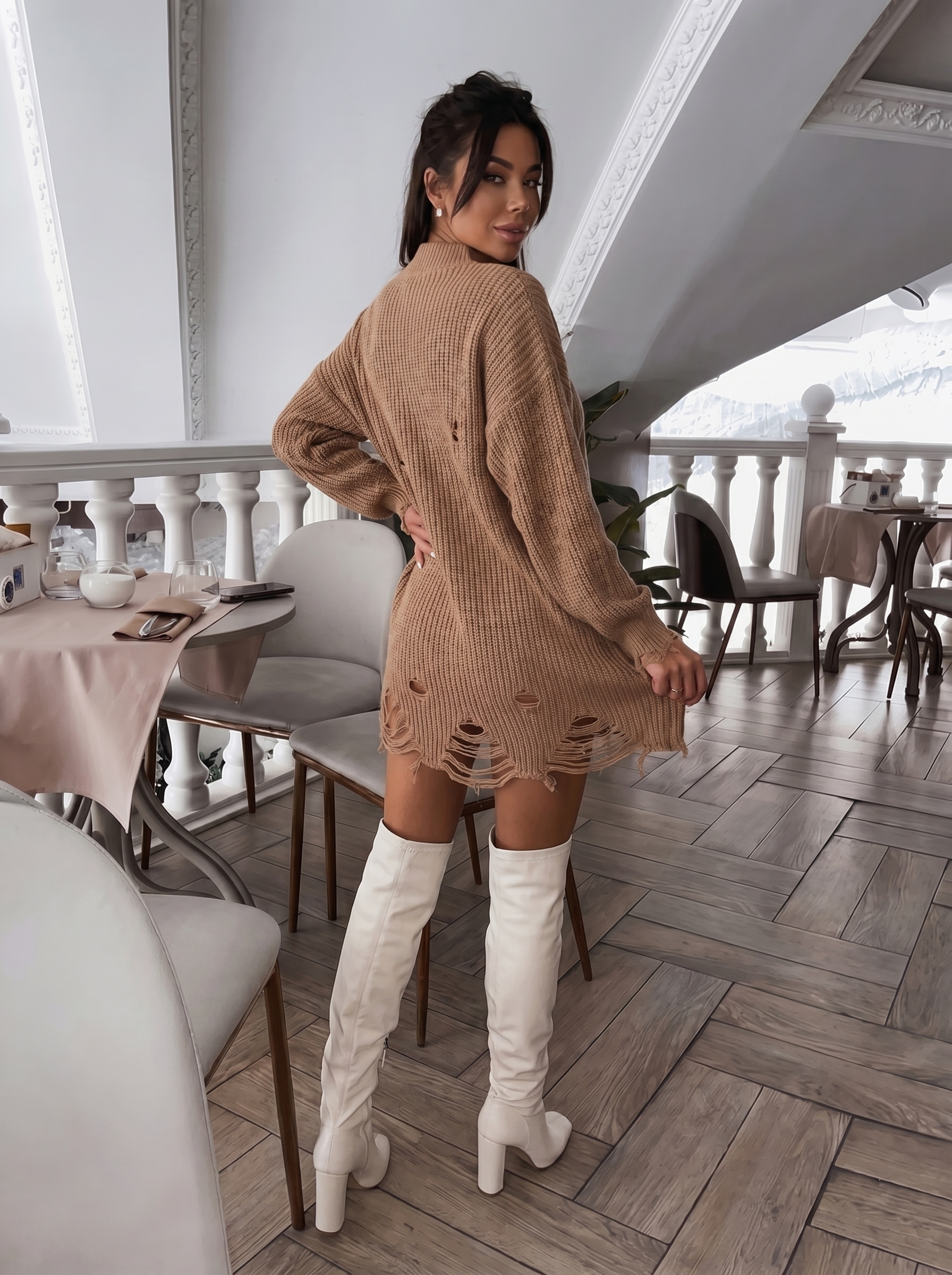 Ribbed knit sweater dress paired with knee-high slouchy boots, chic casual outfit.