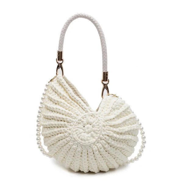 Woven shell-shaped handbag with pearl strap, chic accessory.