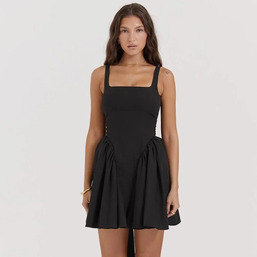 Black square-neck mini dress with ruched sides, versatile evening look.