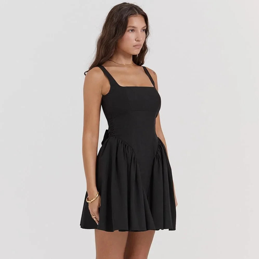 Black sleeveless mini dress with a flared skirt, versatile evening or party wear.