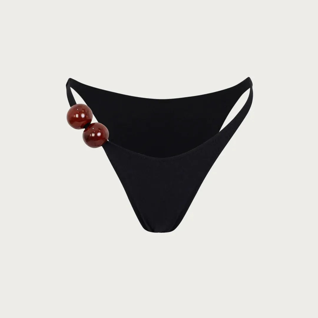Black bikini bottom with decorative side beads, stylish swimwear piece.