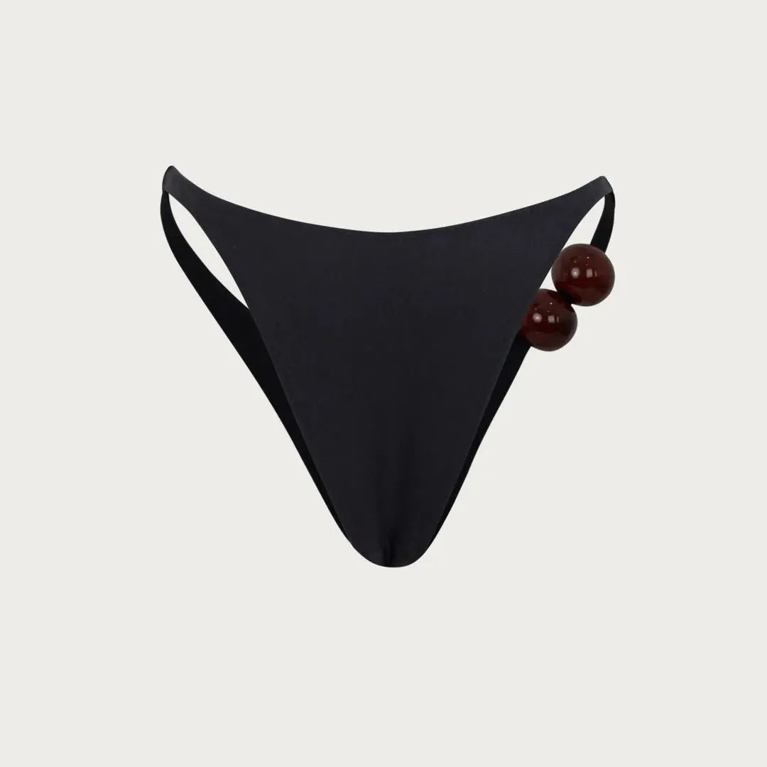 Black bikini bottom with bead detail, swimwear style.