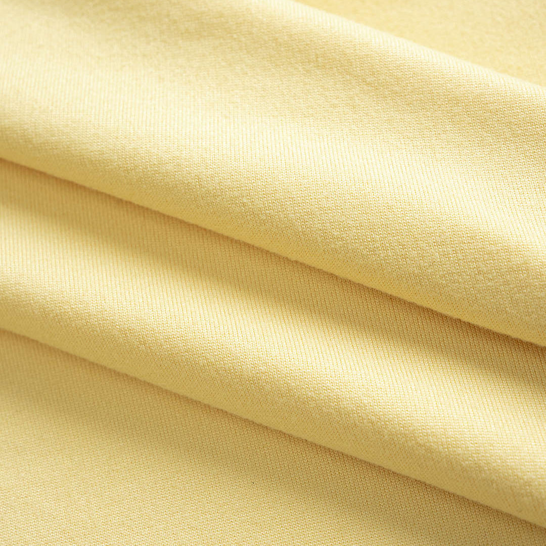 Close-up of beige fabric with a soft texture