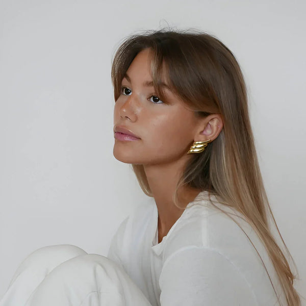 Gold statement ear cuffs, bold accessory piece