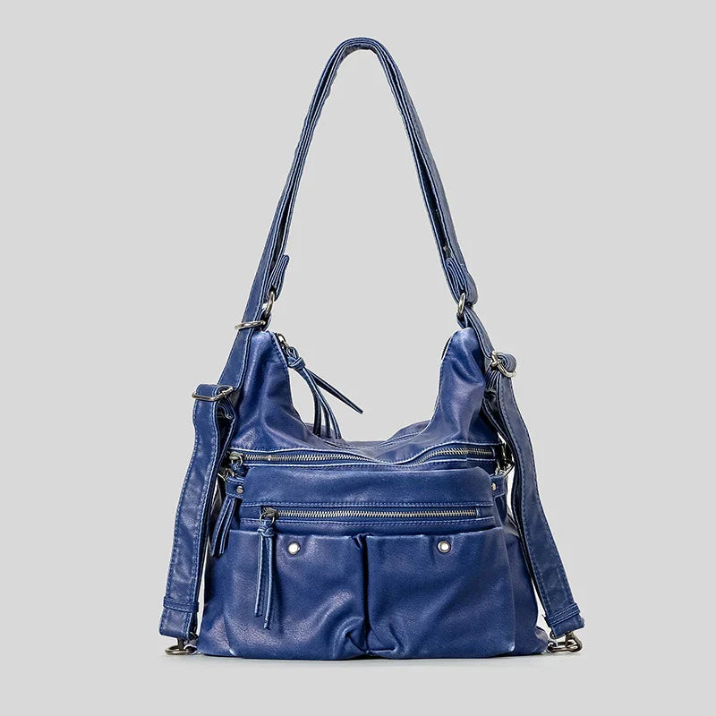 Blue leather handbag with multiple zip compartments, versatile accessory