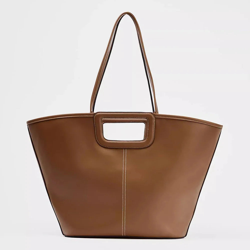Brown tote bag with structured handles.