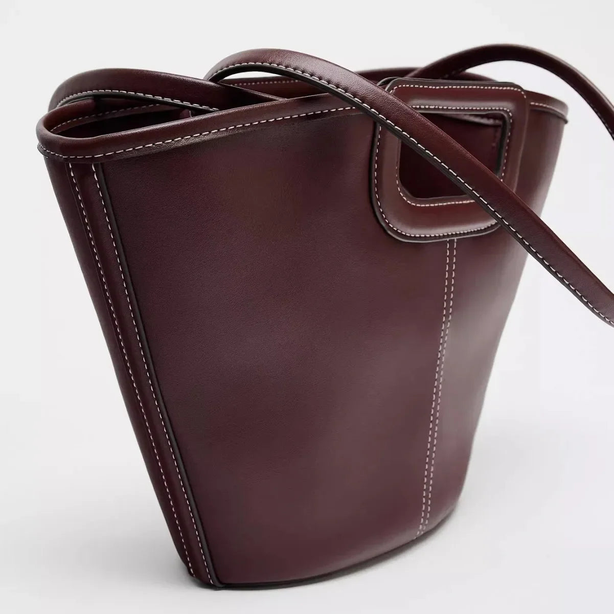 burgundy leather handbag with structured design