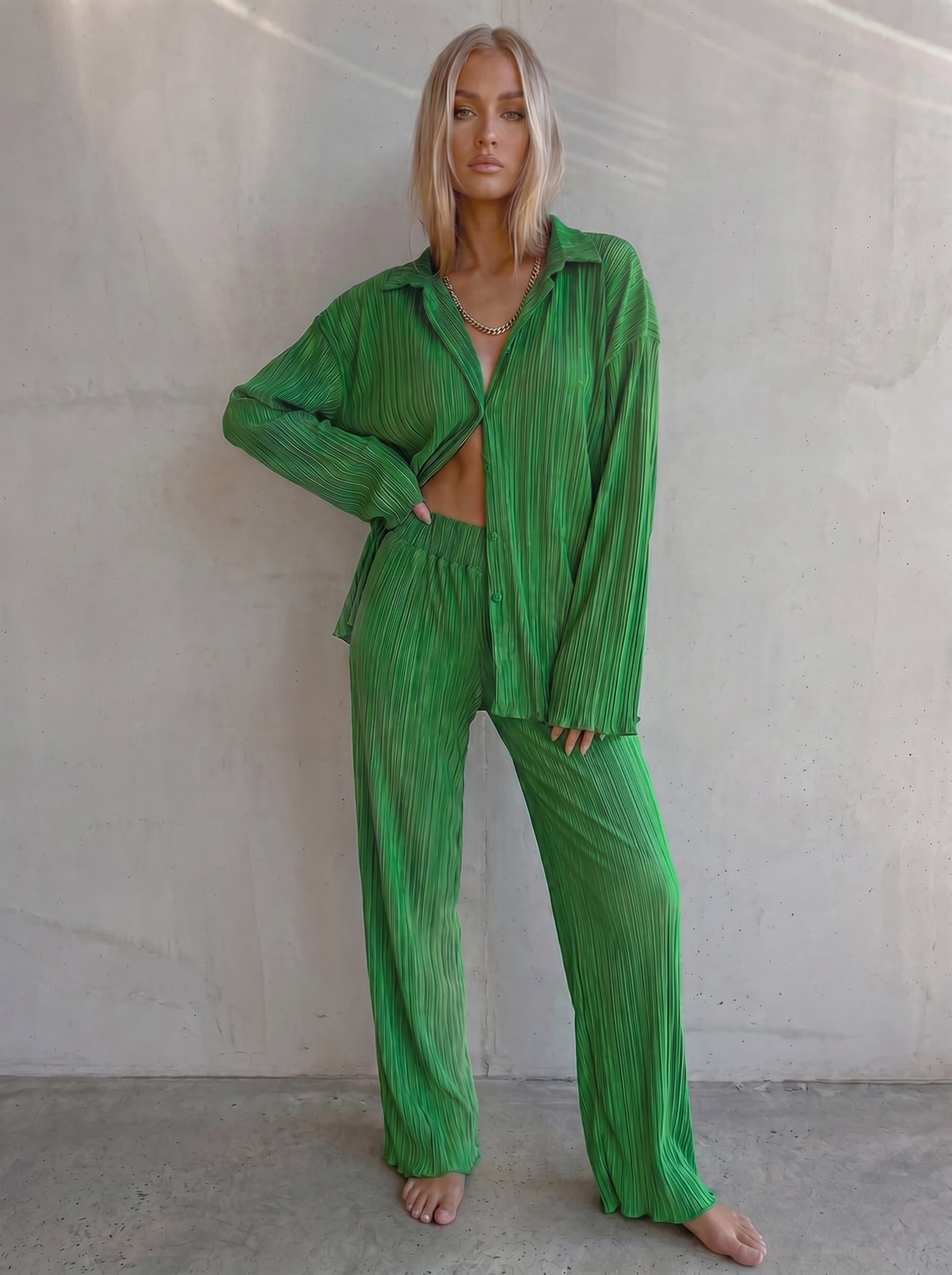 green pleated co-ord set with oversized shirt and wide-leg pants