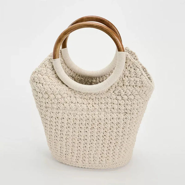 Beige crochet bag with wooden handles.
