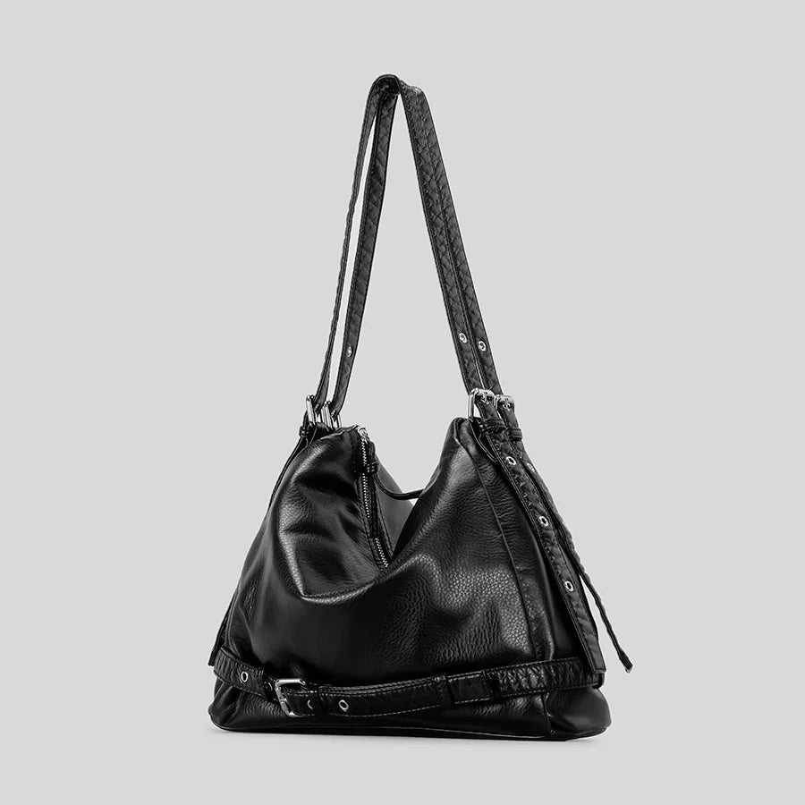 black leather handbag with quilted straps and buckle detail