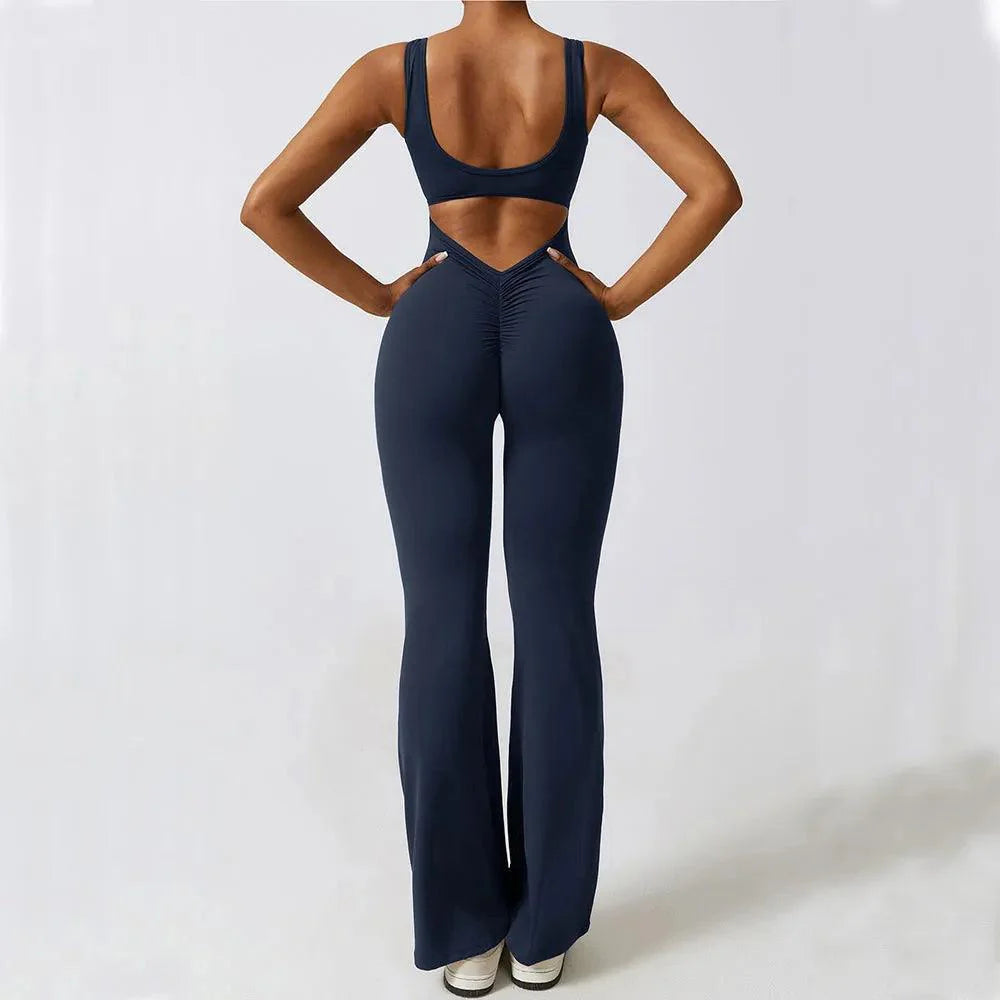 Dark blue push-up jumpsuit with a cut-out back, flared legs, and snug fit, perfect for a chic, night-out look.