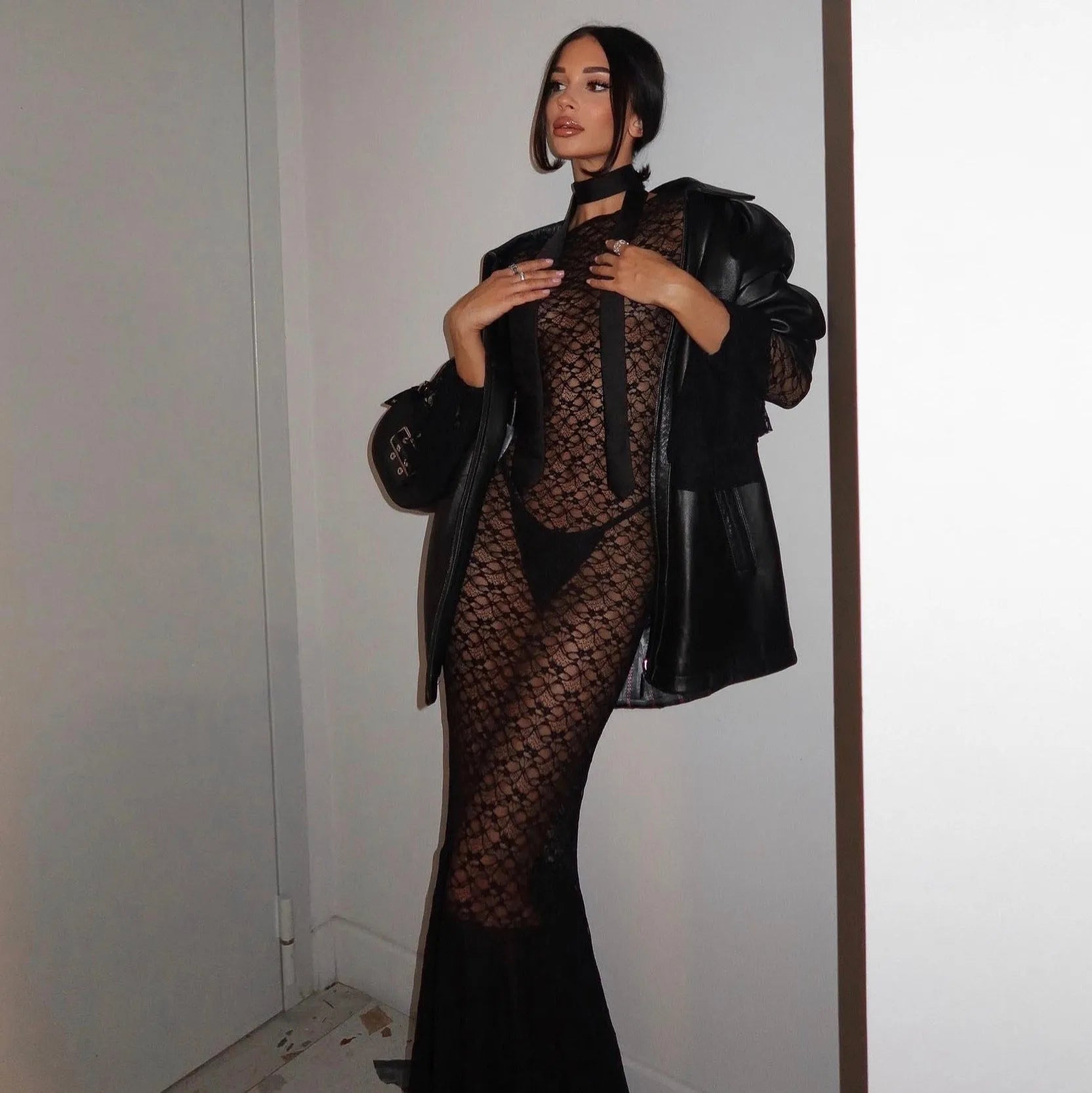 Black lace maxi dress with leather jacket and choker.