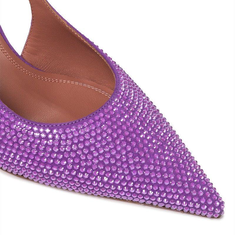 Purple studded flat shoe with brown interior on a white background
