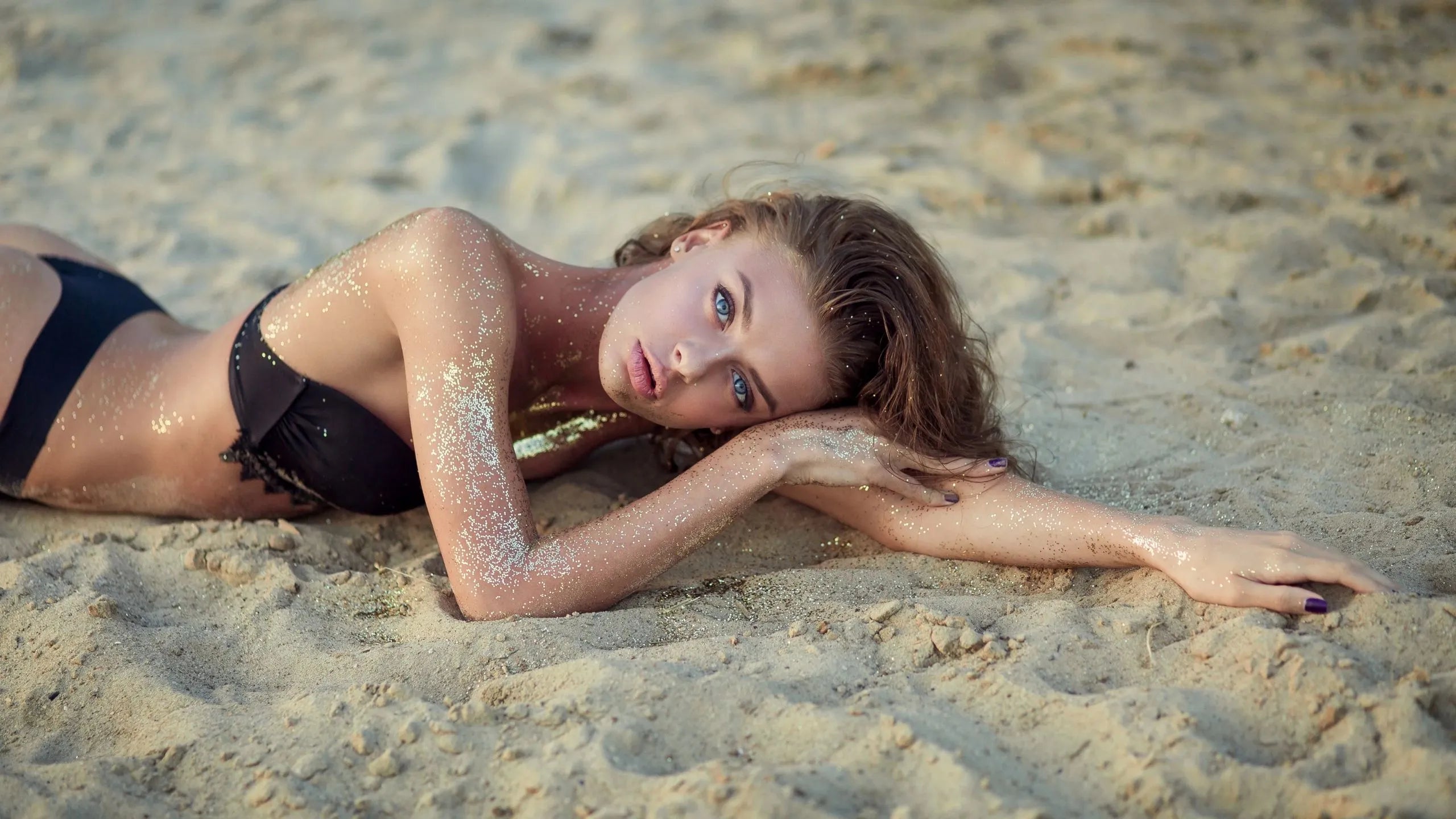 white girl lying on the beach