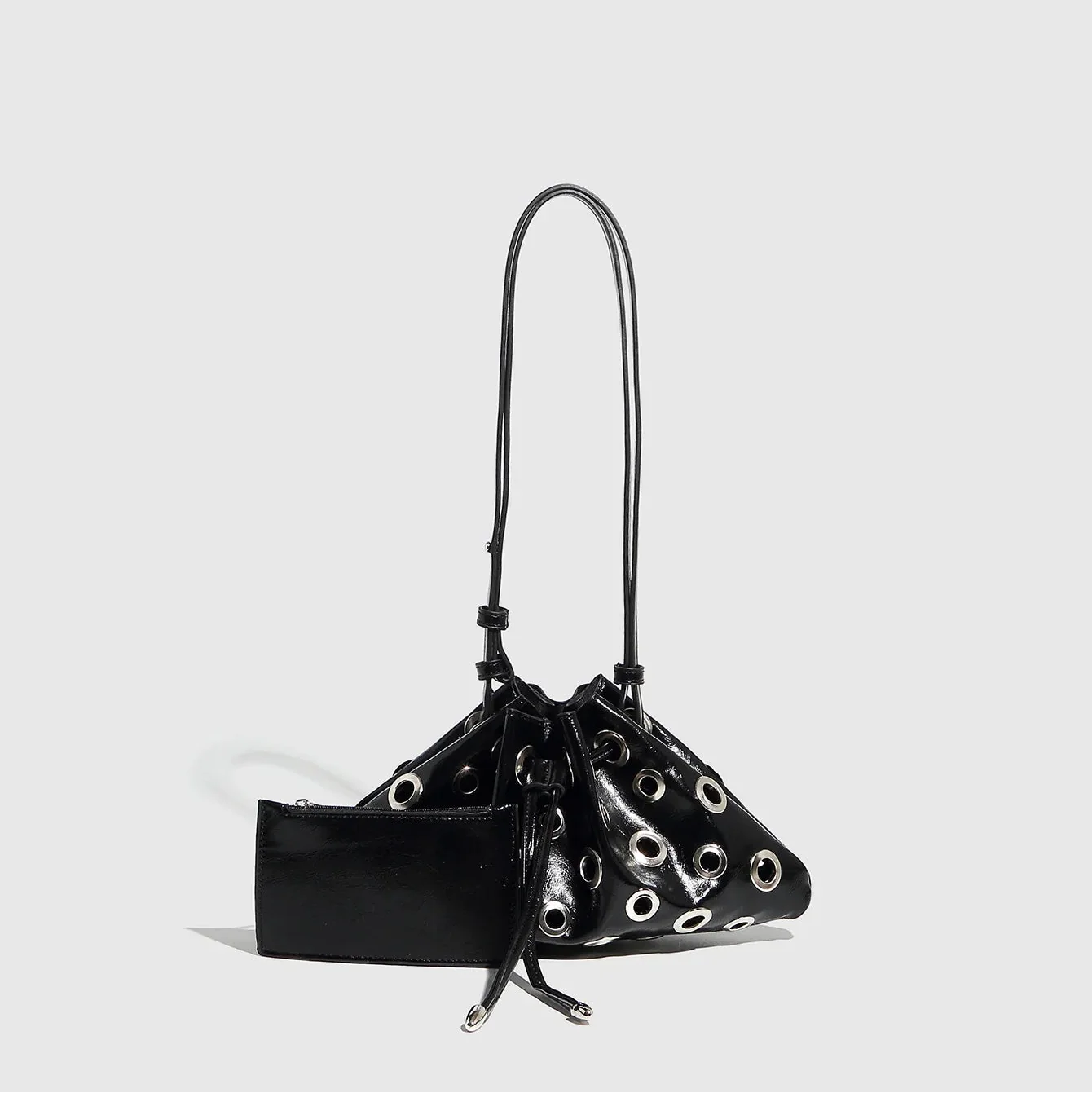 black patent drawstring bag with grommet details, evening accessory